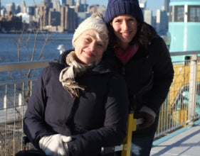 Person in stairlift with assistant