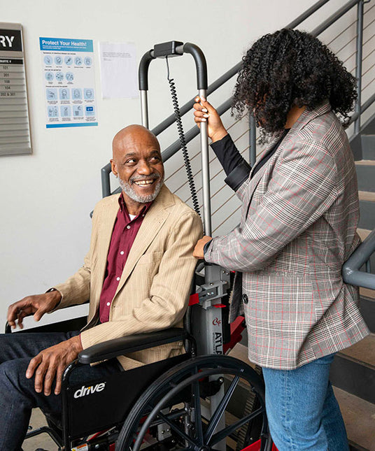 Father and daughter with Atlas stairlift