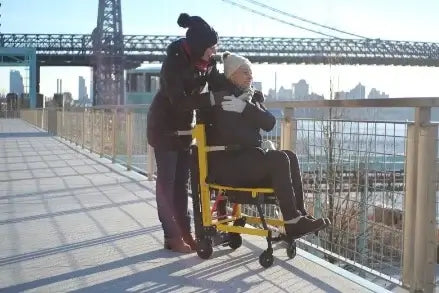 Person seated on a stairlift ascending