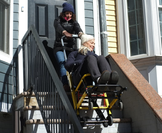 Person lifting stairlift into vehicle