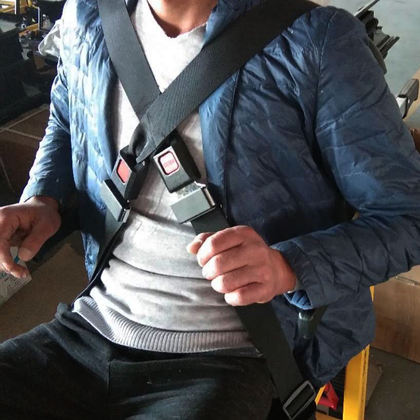 Rider wearing the 4-Point Harness across the chest and shoulders for secure support on Mobile Stairlift