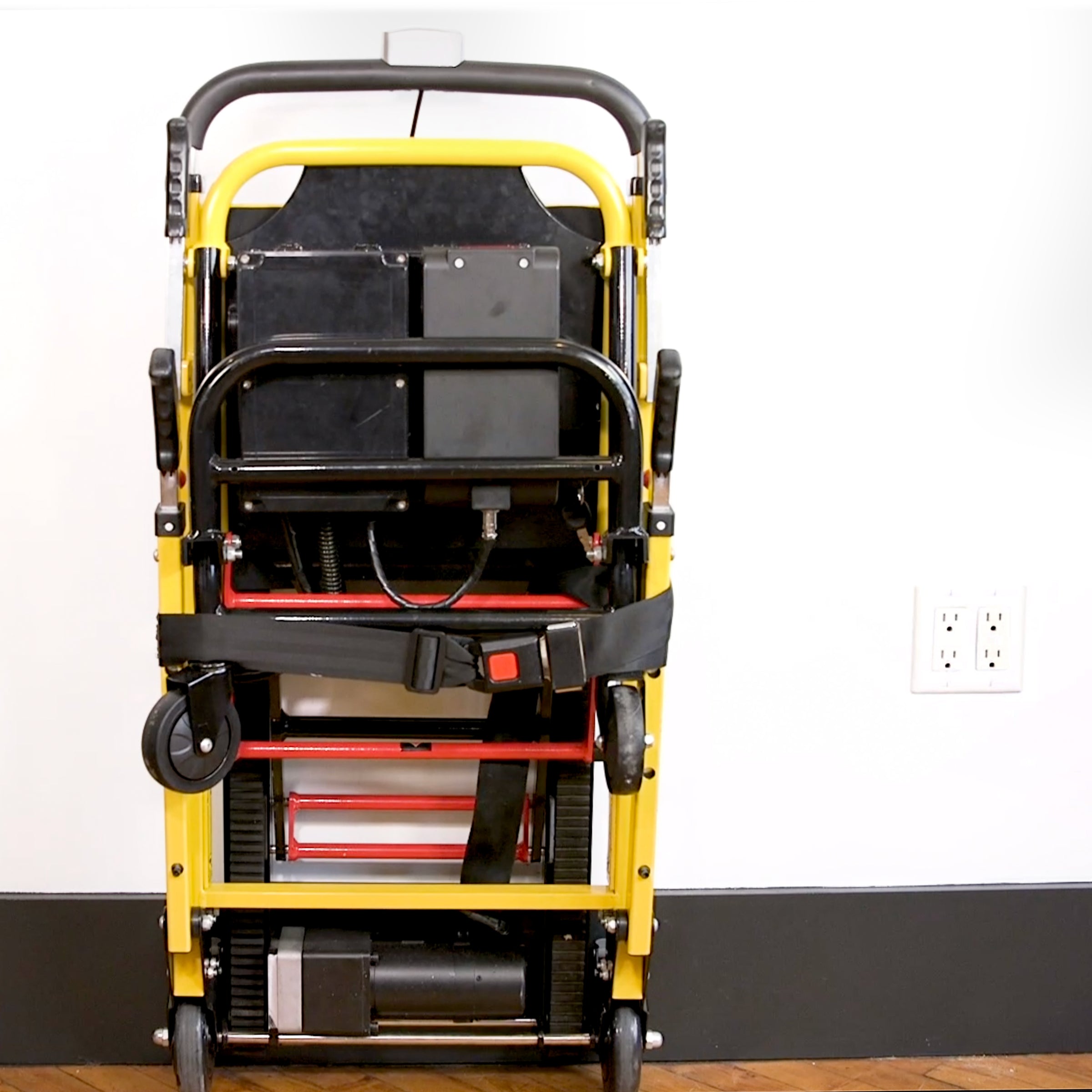 Mobile Stairlift stored upright against the wall using the Wall Mount Storage Hook to save floor space